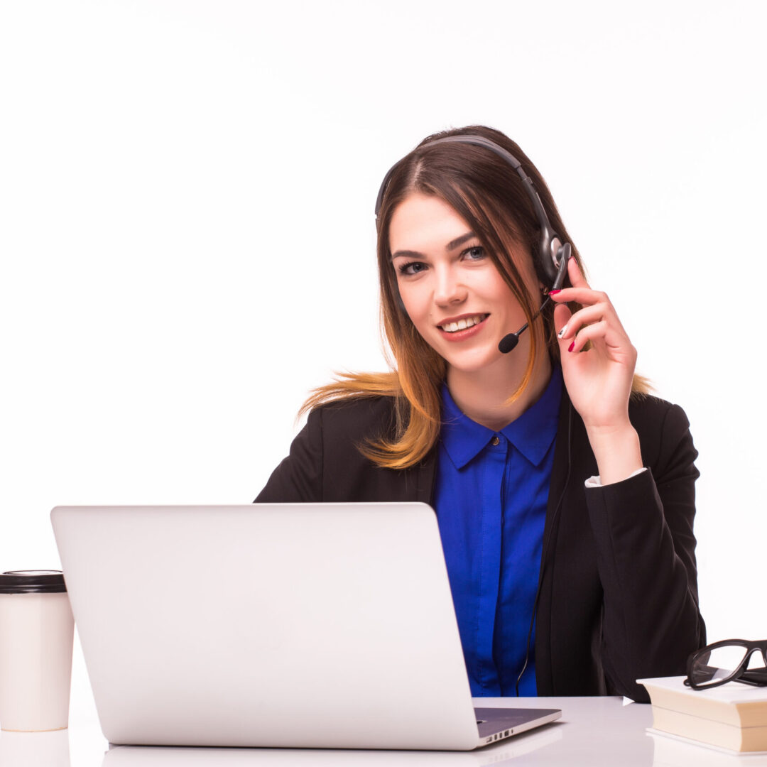 Portrait of smiling cheerful beautiful young support phone operator in headset with laptop, isolated over white background